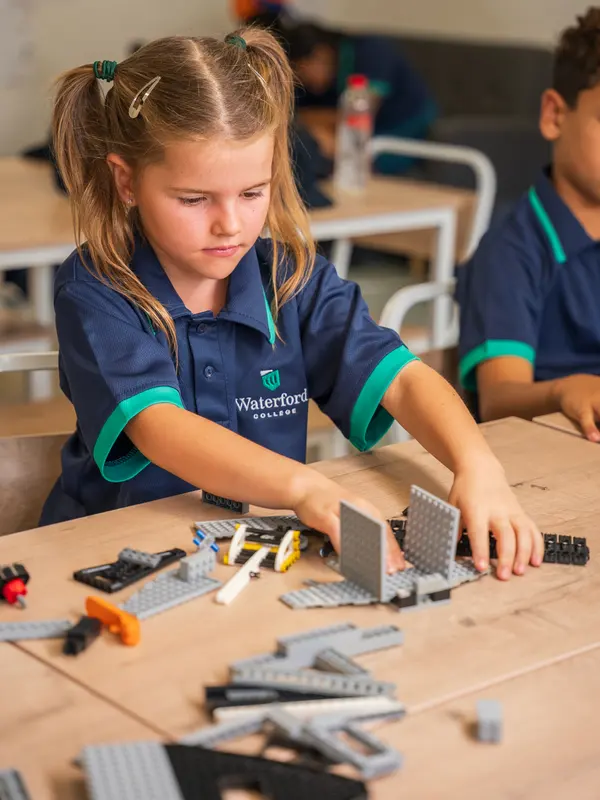 A child building with construction blocks