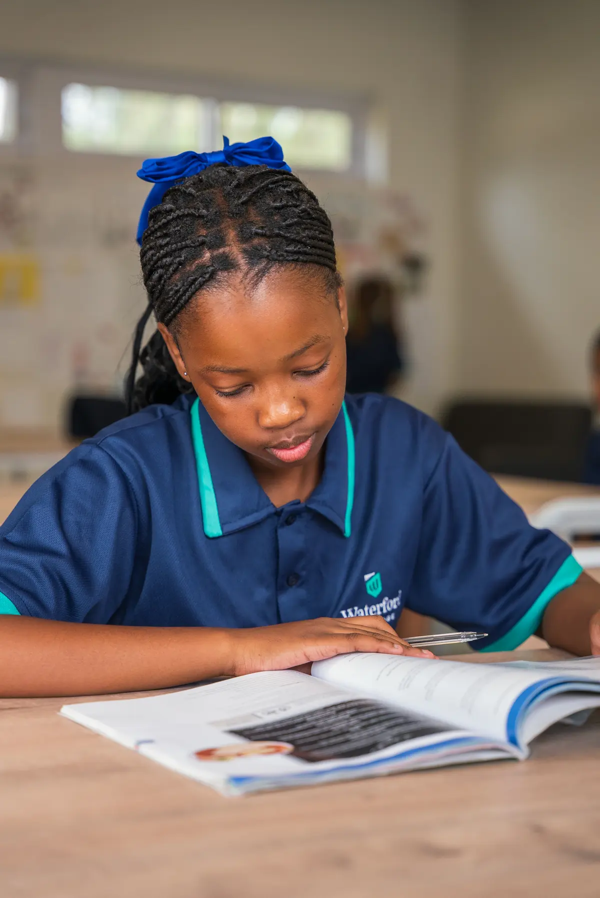 A child writing carefully in a workbook